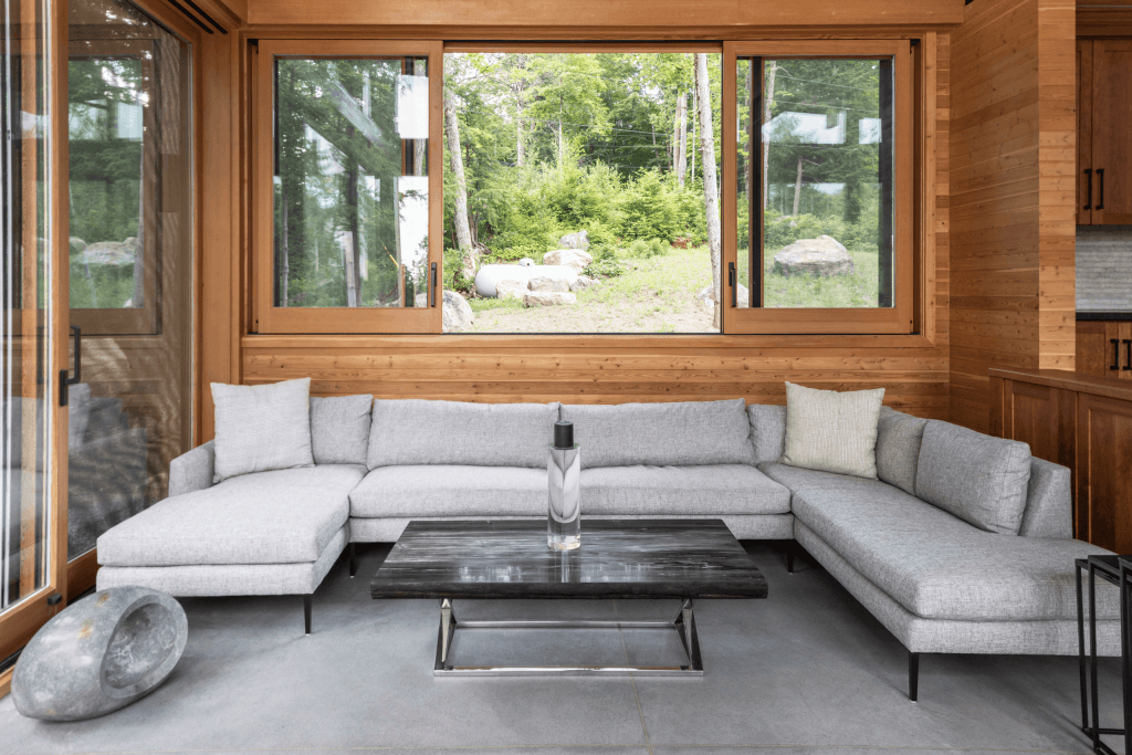 Barlochan Cottage living room with floor-to-ceiling windows — Heated Rivalry Airbnb